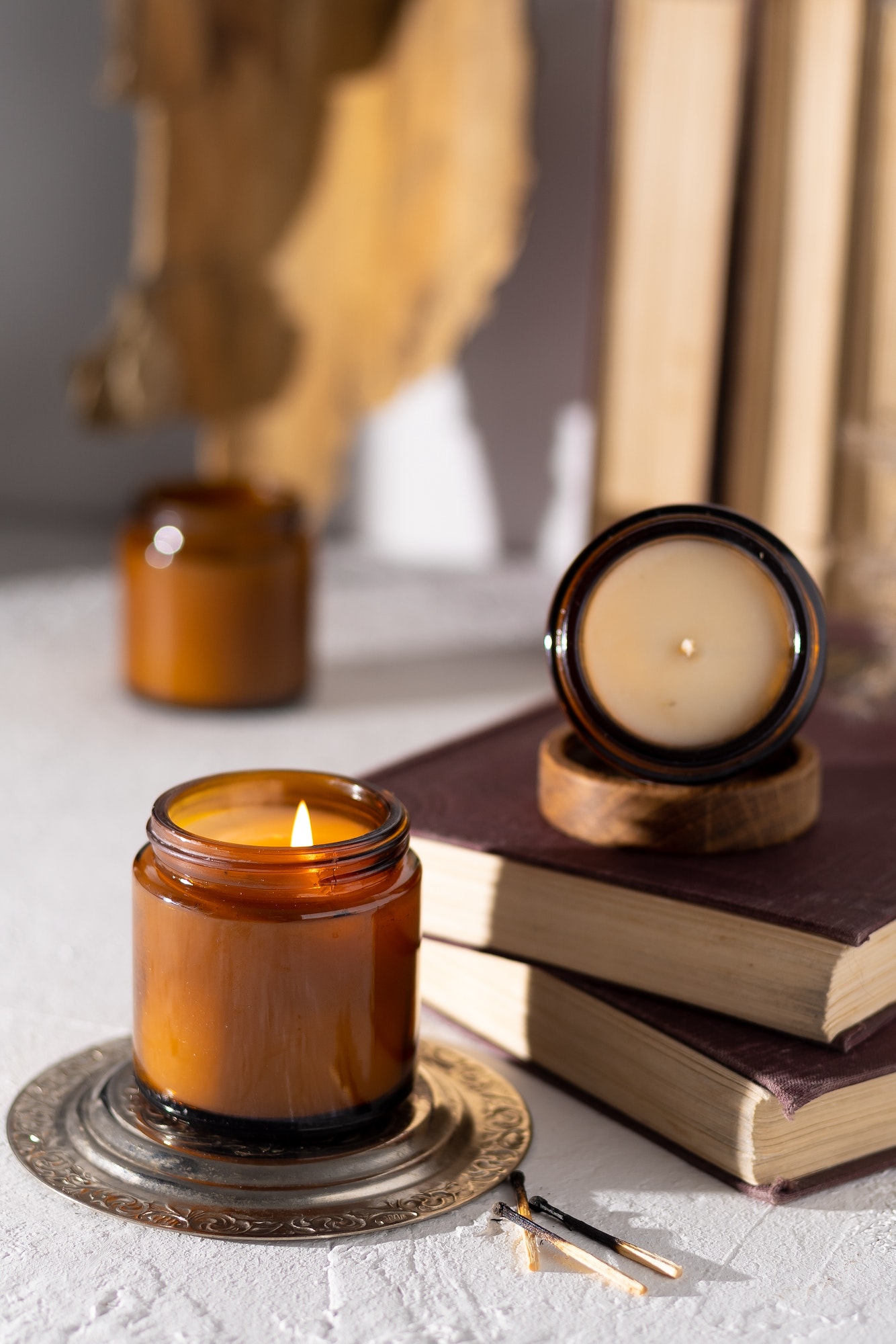 A set of different aroma candles in brown glass jars. Scented handmade candle. Soy candles